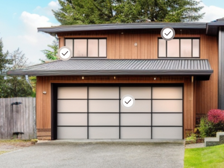 The exterior of a two story home with checkmark graphics superimposed on top of the windows and garage door.